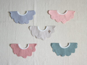 Peach scallop bib